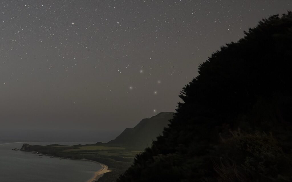 Coastline starry sky scenery at Nagareboshi no Oka stargazing spot, Ishigaki Island