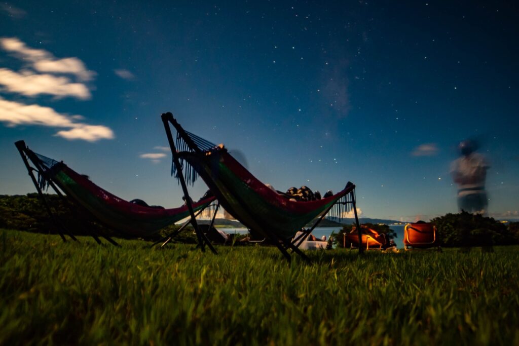 Hammock starry sky ocean at Nagareboshi no Oka stargazing spot, Ishigaki Island