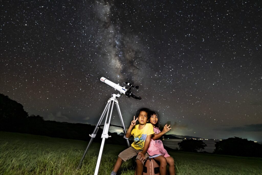 Kids two telescope milky way at Nagareboshi no Oka stargazing spot, Ishigaki Island
