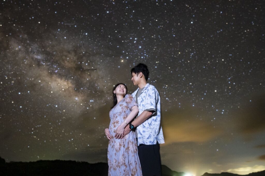 Maternity couple milky way landscape at Nagareboshi no Oka stargazing spot, Ishigaki Island